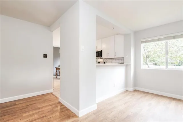 a view of a kitchen with a sink cabinets and a window