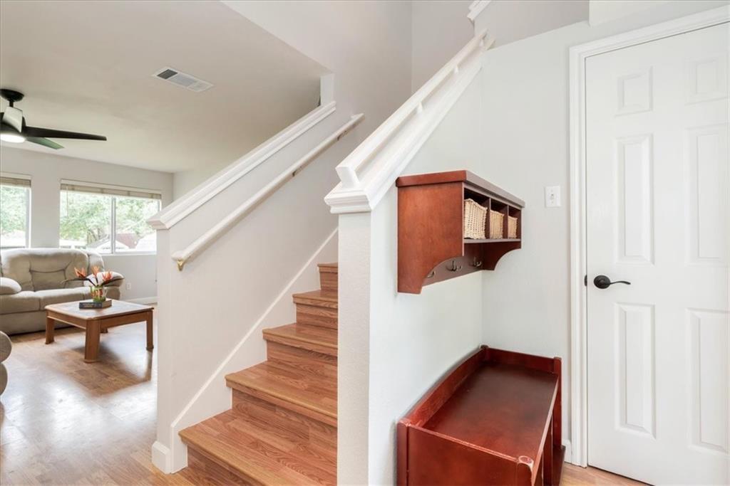 20805 Jumpers Delight Lane Pflugerville, TX 78660 - Photo 13 of 24 Staircase with wood finished floors and ceiling fan