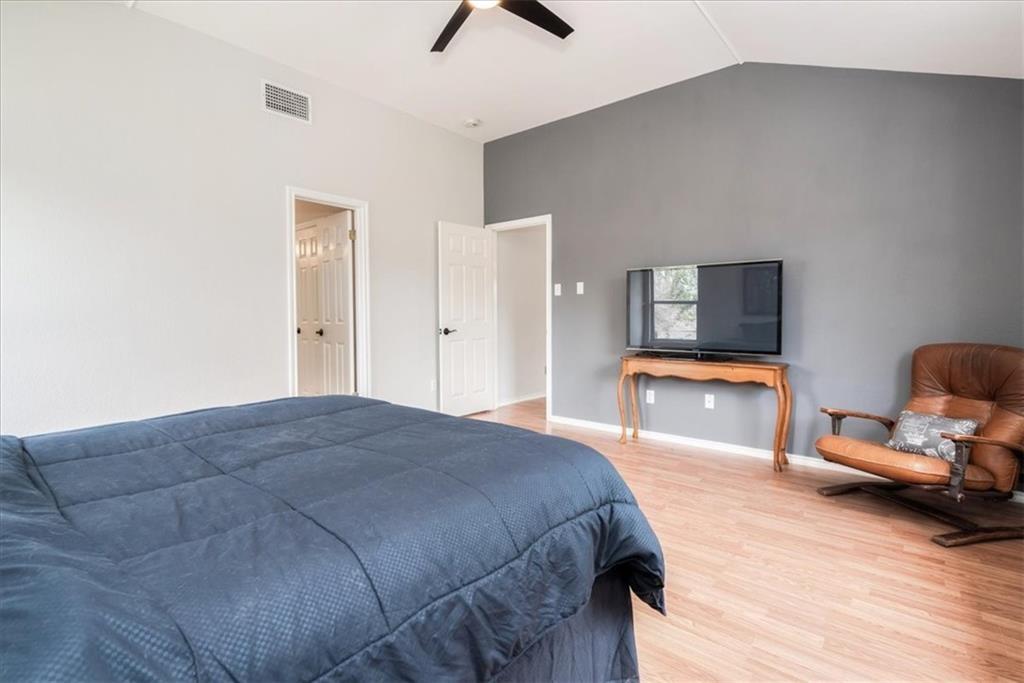 20805 Jumpers Delight Lane Pflugerville, TX 78660 - Photo 17 of 24 Bedroom featuring light wood-type flooring and ceiling fan
