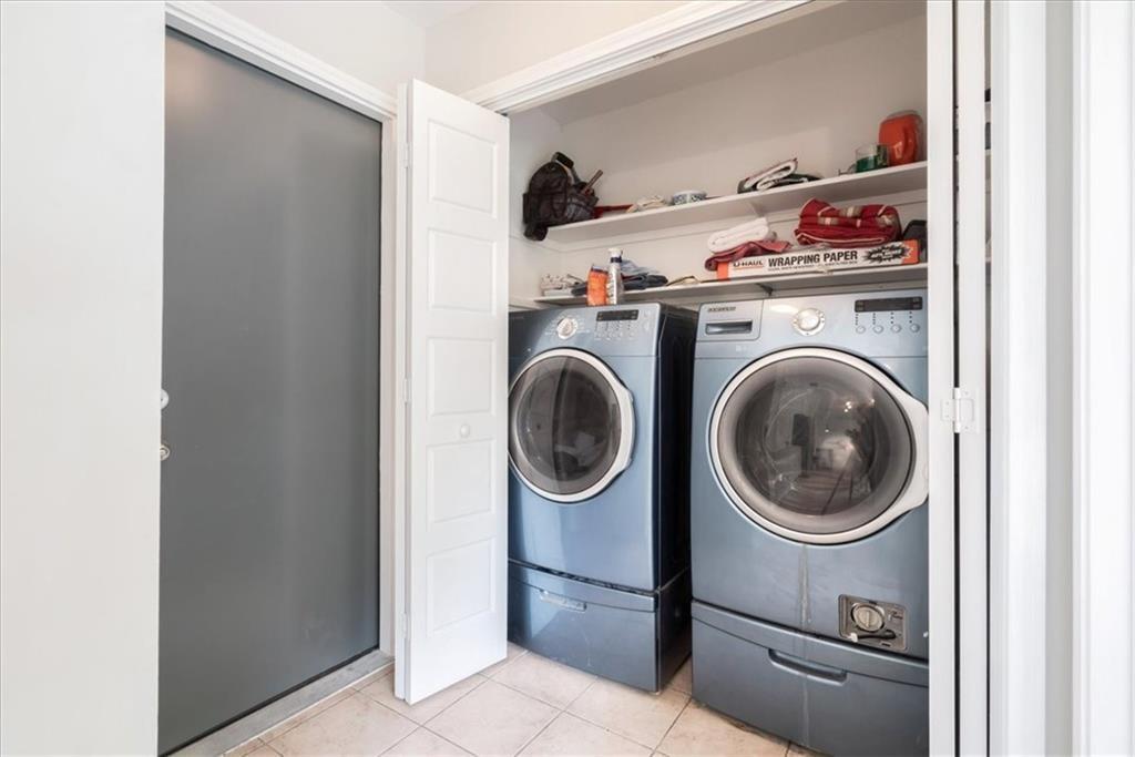 20805 Jumpers Delight Lane Pflugerville, TX 78660 - Photo 21 of 24 Laundry area featuring light tile patterned floors and washing machine and clothes dryer