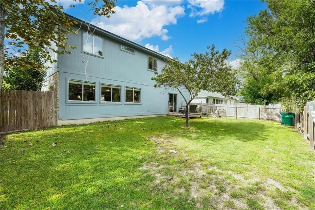 20805 Jumpers Delight Lane Pflugerville, TX 78660 - Photo 23 of 24 Rear view of property with a fenced backyard and a deck