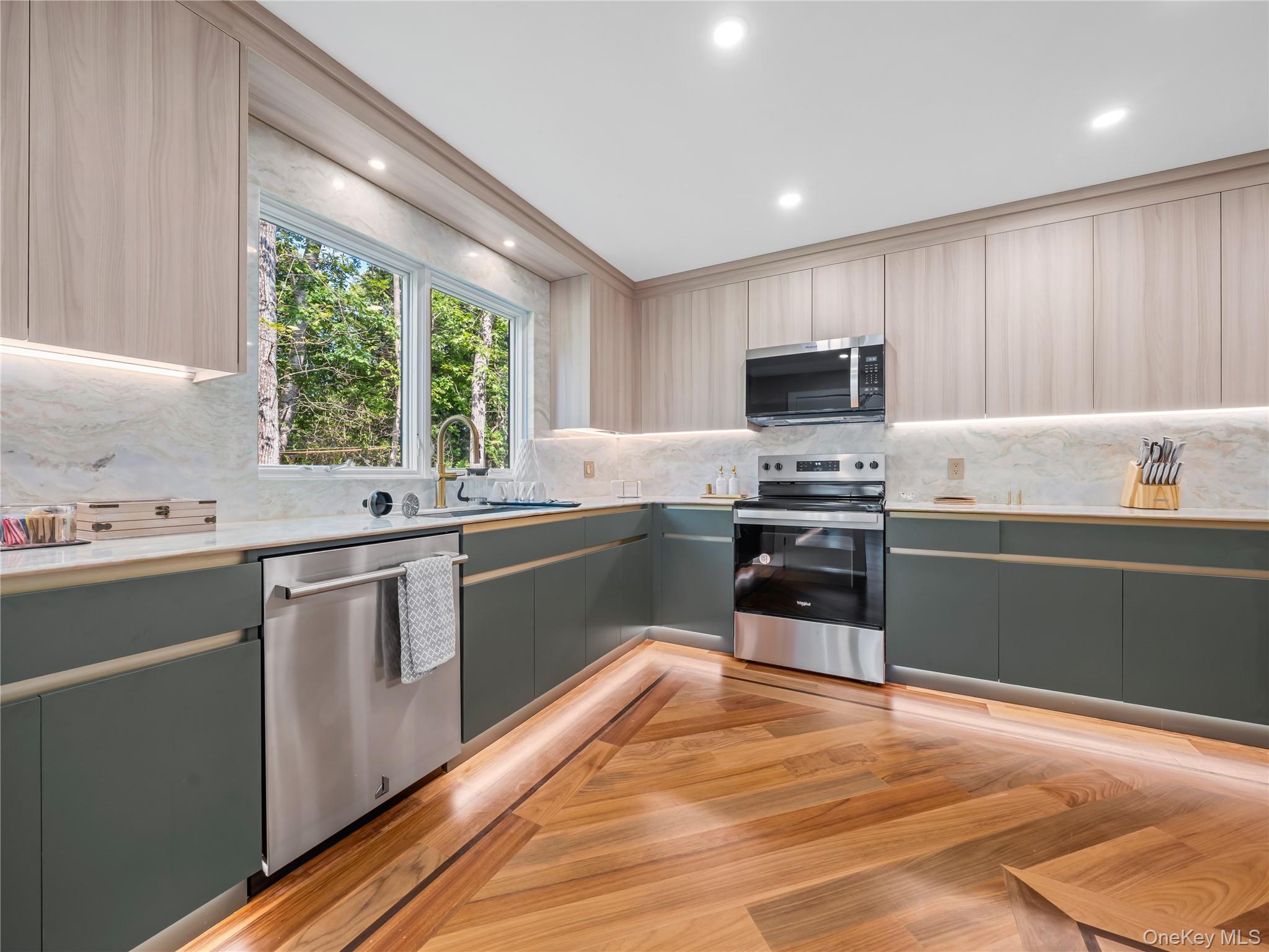5 North Hills Road East Norwich, NY 11732 - Photo 16 of 50 a kitchen with granite countertop a stove top oven a sink dishwasher a refrigerator and a oven with wooden floor