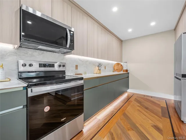 a kitchen with a stove and a microwave