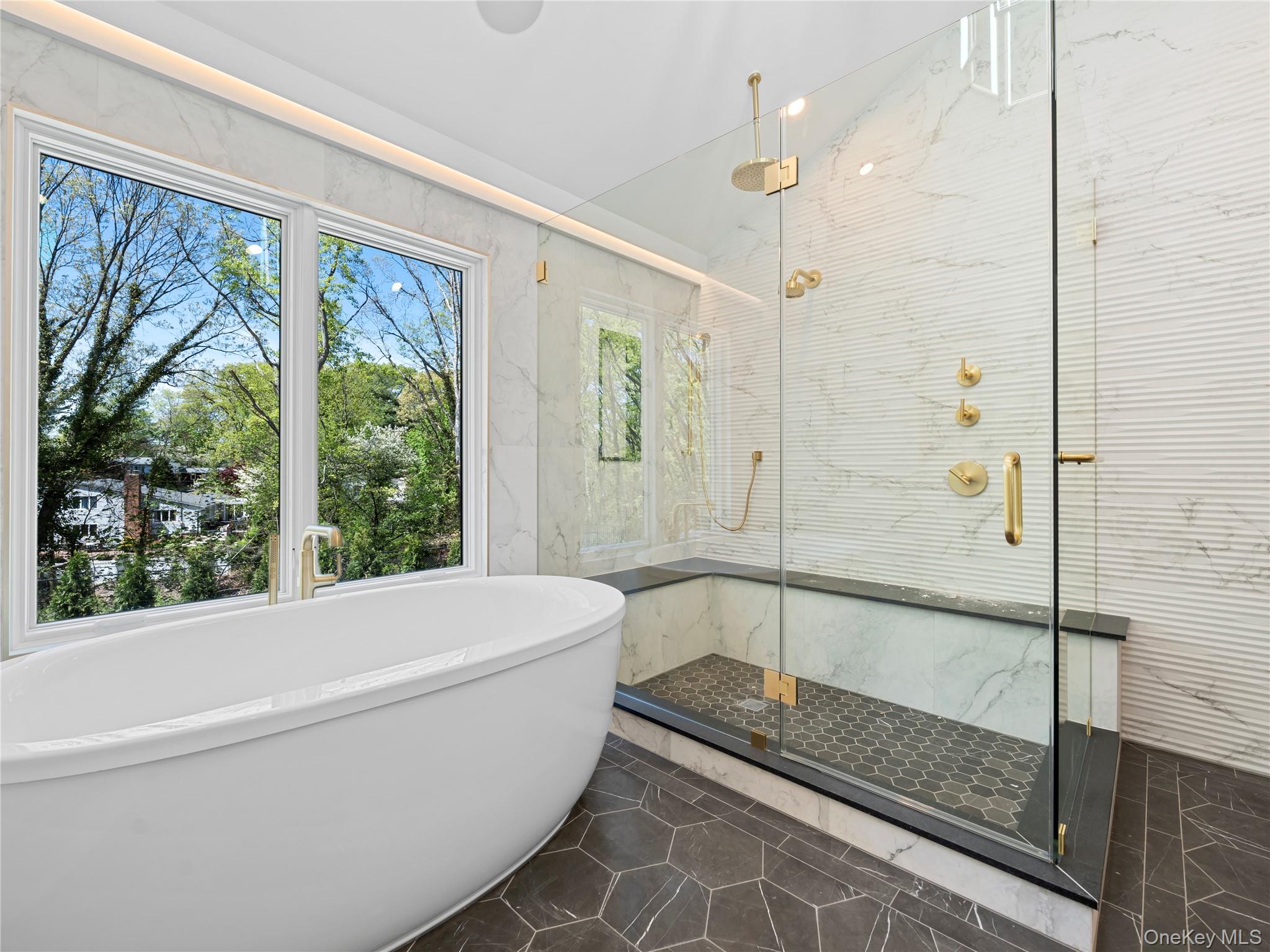 5 North Hills Road East Norwich, NY 11732 - Photo 29 of 50 a bathroom with a bathtub and a shower