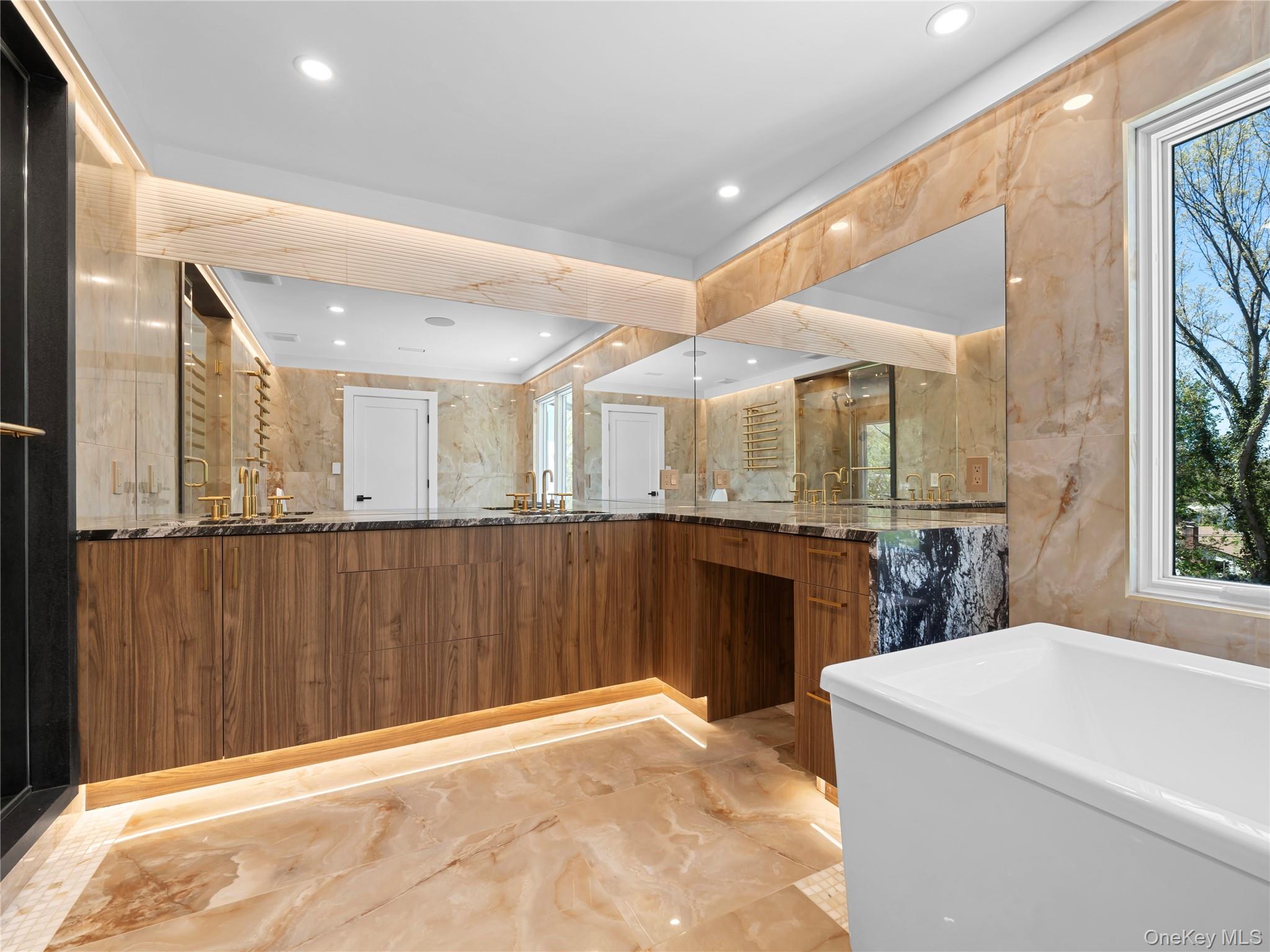 5 North Hills Road East Norwich, NY 11732 - Photo 31 of 50 a large white kitchen with a large window