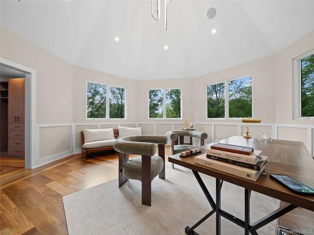a bathroom with a granite countertop sink a mirror and shower