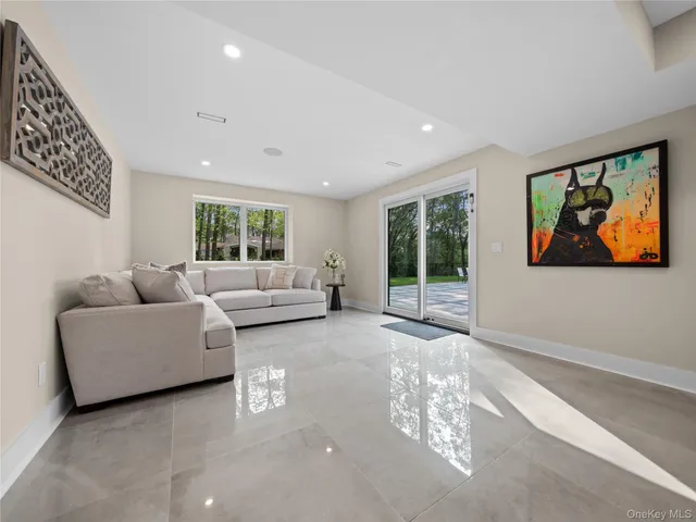 a spacious bedroom with a bed and a window