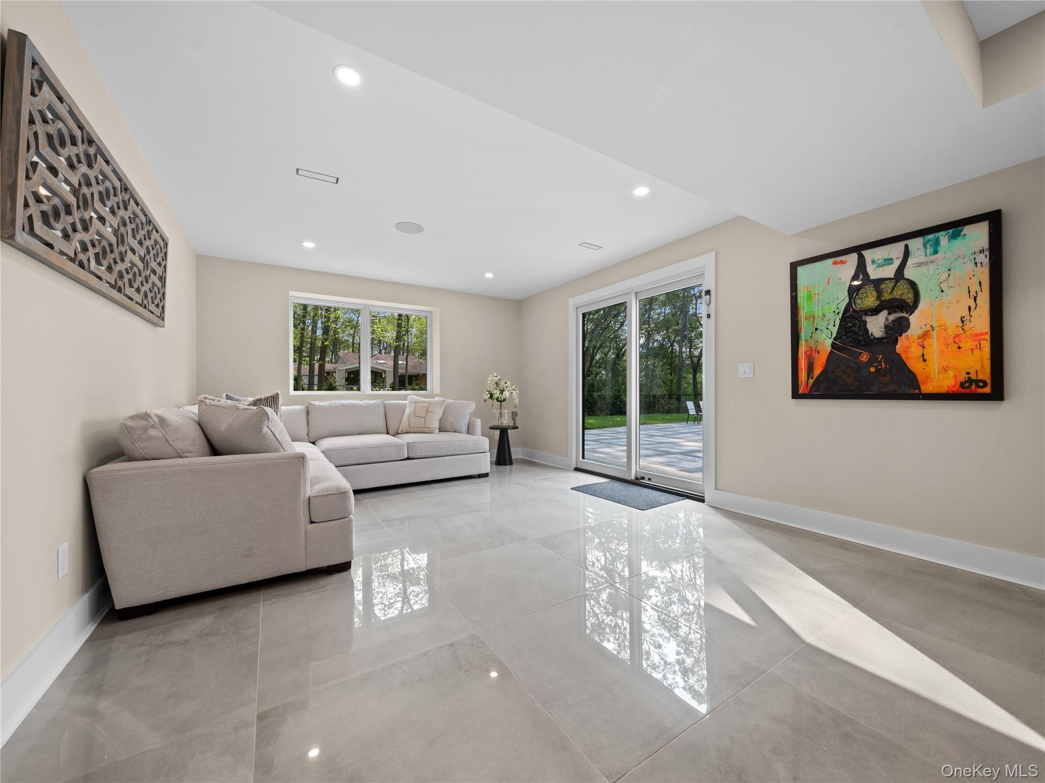 5 North Hills Road East Norwich, NY 11732 - Photo 42 of 50 a living room with furniture and a large window