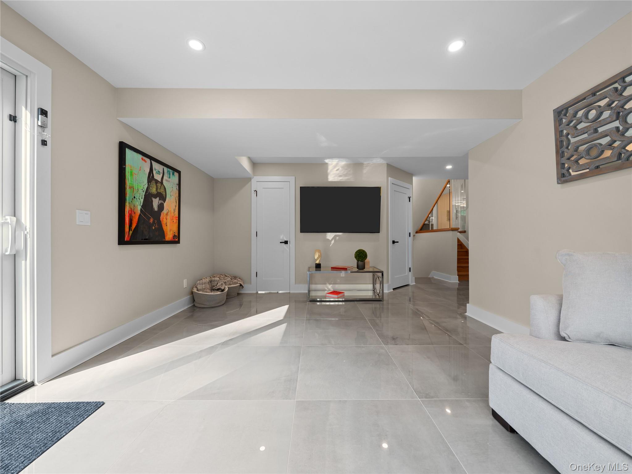 5 North Hills Road East Norwich, NY 11732 - Photo 44 of 50 a living room with furniture and a flat screen tv