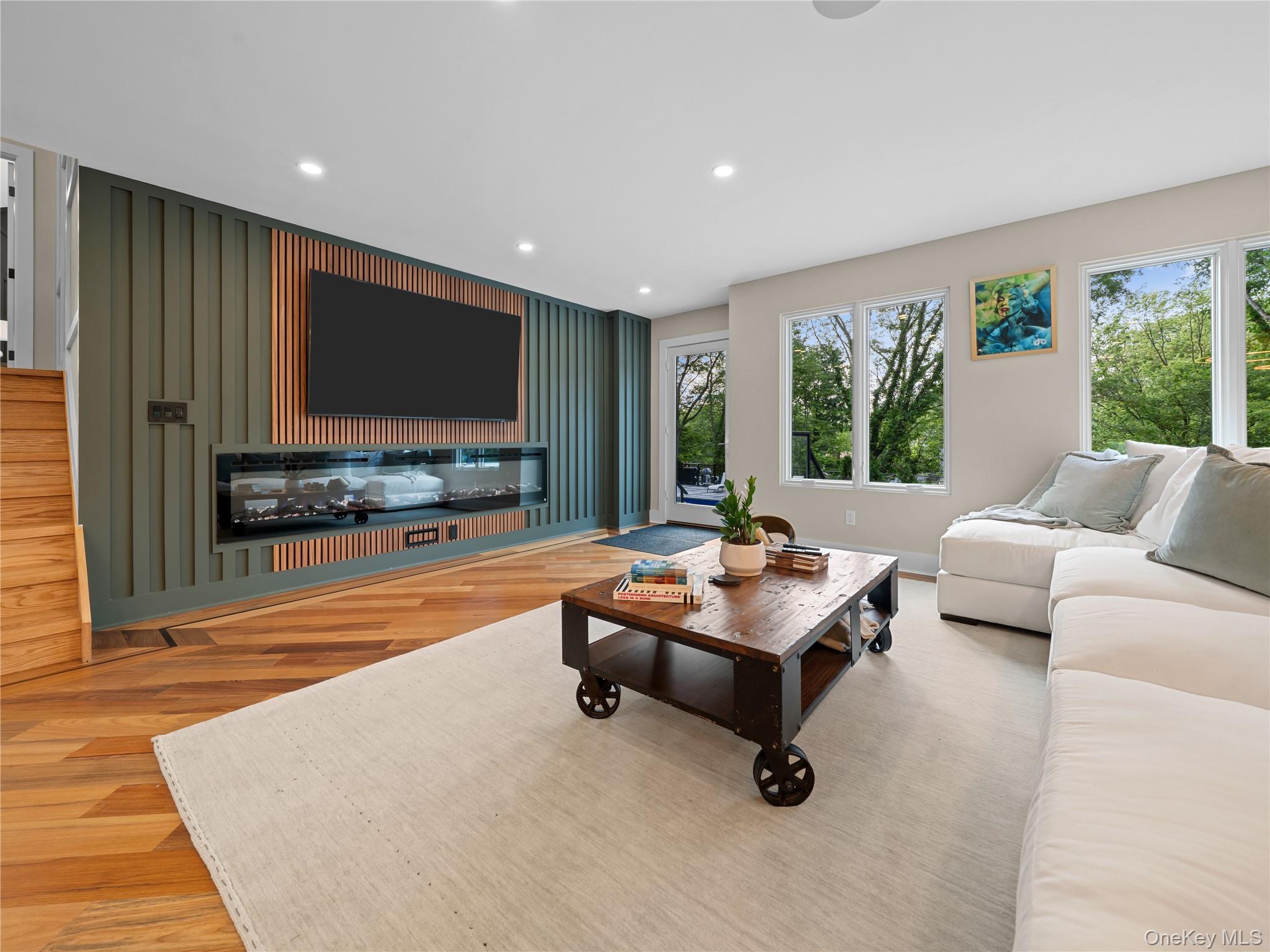 5 North Hills Road East Norwich, NY 11732 - Photo 10 of 50 a living room with furniture and a flat screen tv