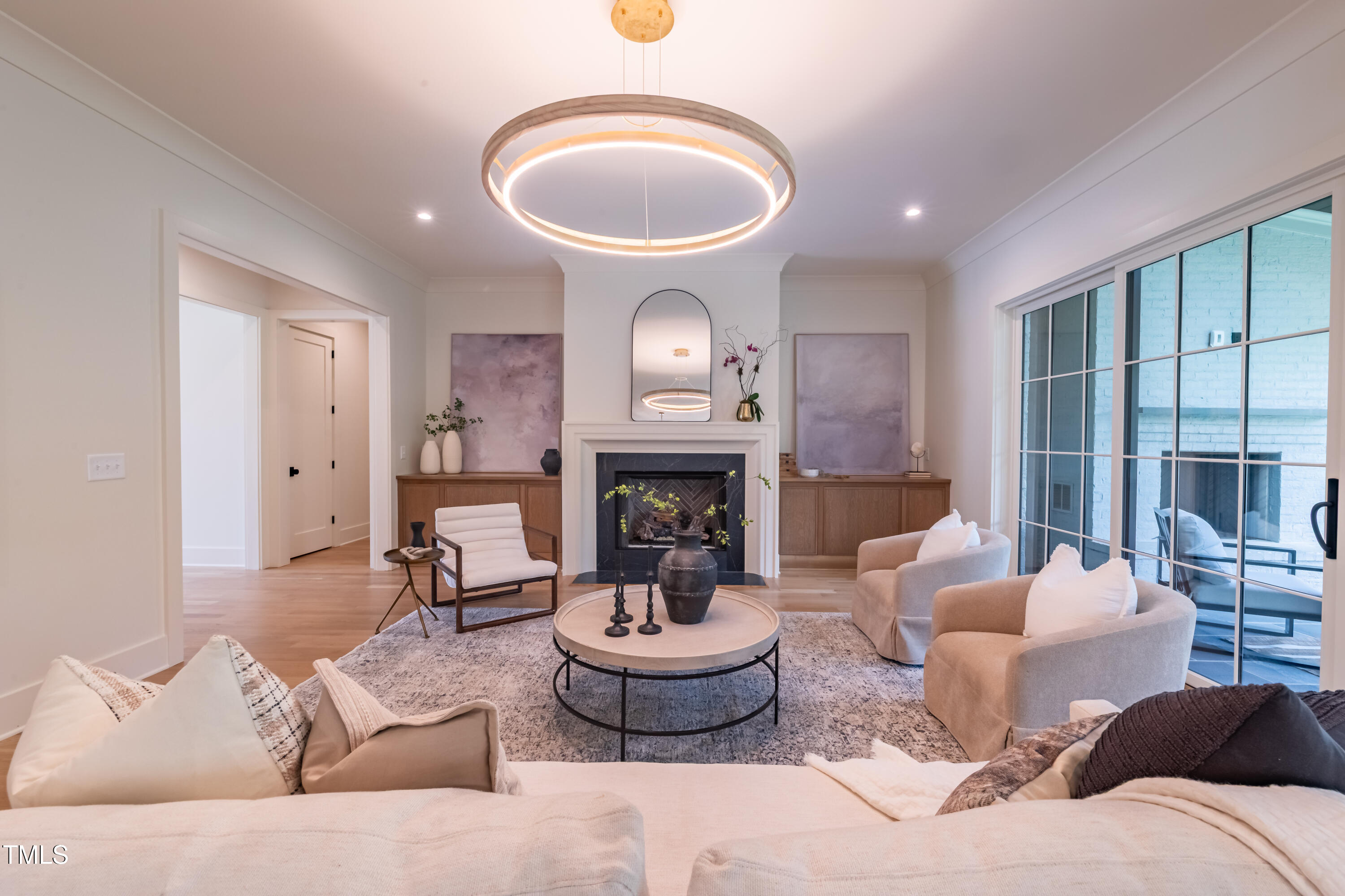 2227 Wheeler Road Raleigh, NC 27607 - Photo 14 of 56 a living room with furniture a fireplace and a large window