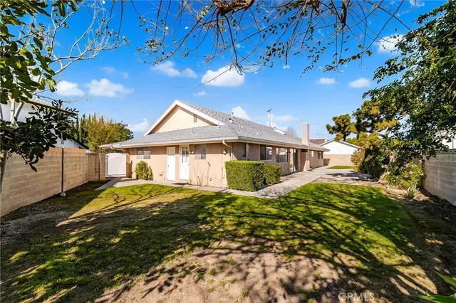 an aerial view of multiple houses with yard