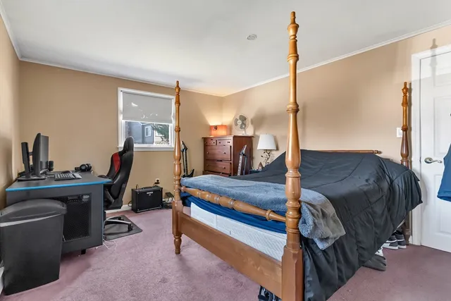 a bedroom with a bed and a table