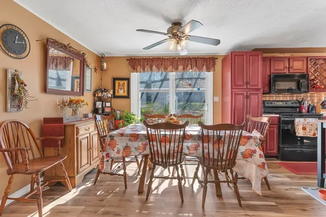 a view of a dining room with furniture window and outside view