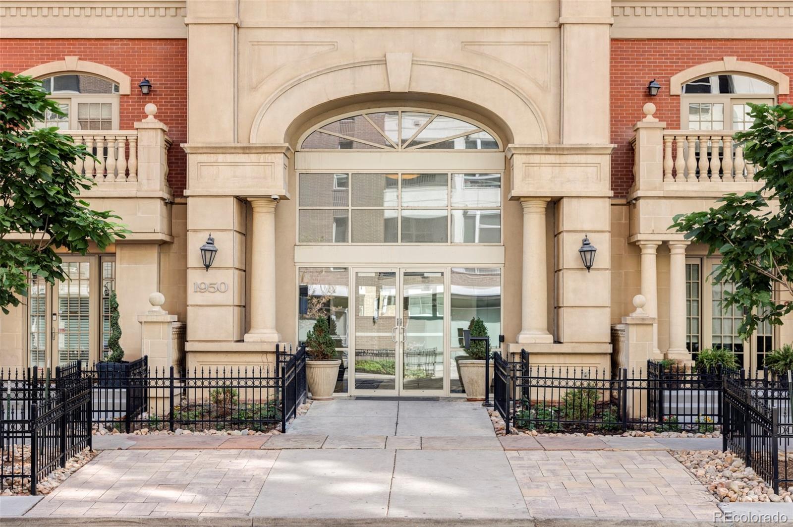 a view of a brick building with many windows