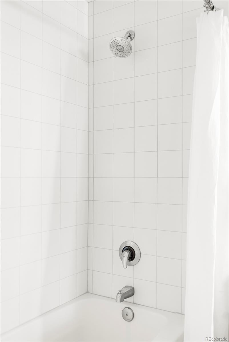 1950 Logan Street, Unit 1013 Denver, CO 80203 - Photo 21 of 23 a bathroom with a shower