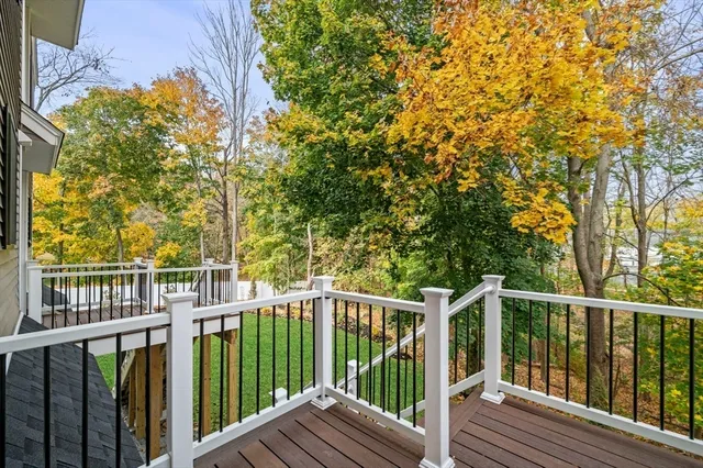 a view of a wooden fence and trees