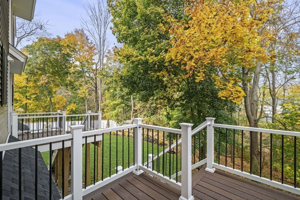 9 Acton Road, Unit 4 Chelmsford, MA 01824 - Photo 11 of 30 a view of a wooden fence and trees
