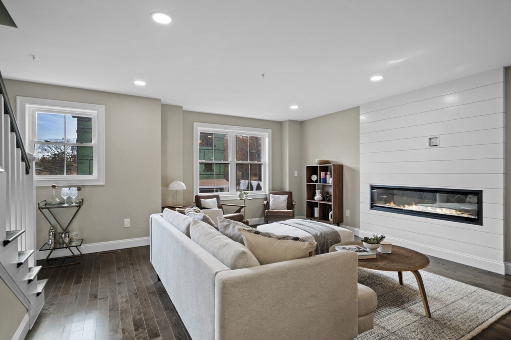 9 Acton Road, Unit 4 Chelmsford, MA 01824 - Photo 13 of 30 a living room with furniture and a flat screen tv