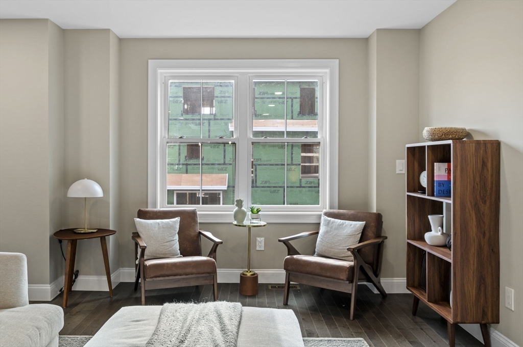 9 Acton Road, Unit 4 Chelmsford, MA 01824 - Photo 15 of 30 a living room with furniture and a window