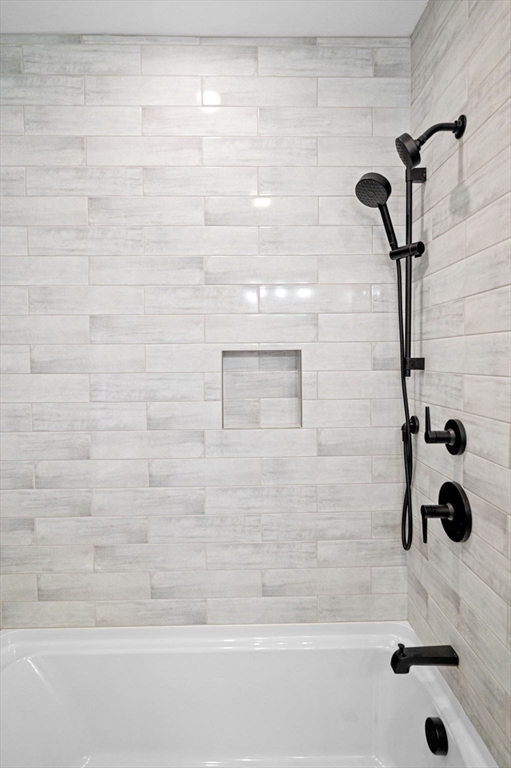 9 Acton Road, Unit 4 Chelmsford, MA 01824 - Photo 18 of 30 a bathroom with a shower