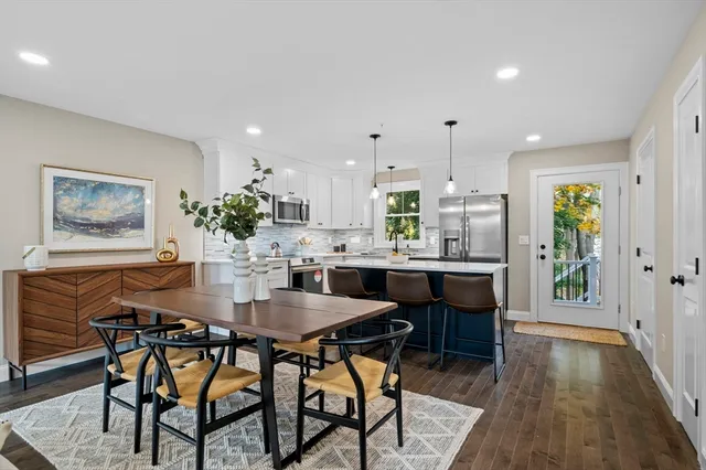 a kitchen with a table and chairs in it