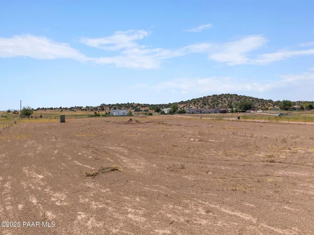 a view of a lake with houses in the back