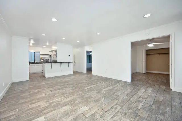 a view of a kitchen with a sink and cabinets