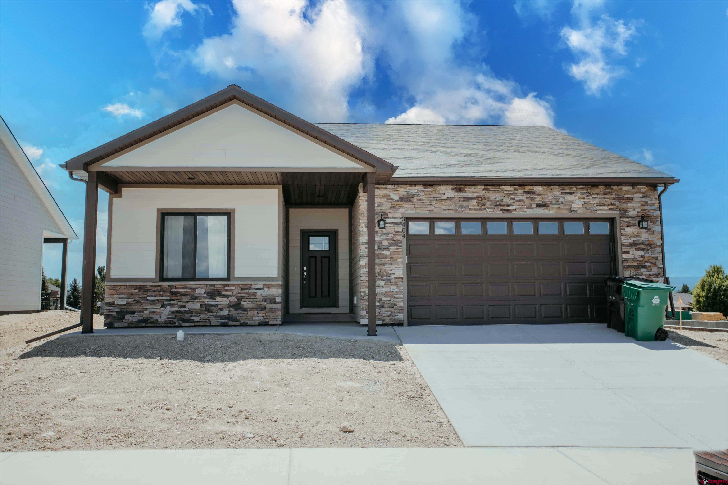 a front view of a house with yard