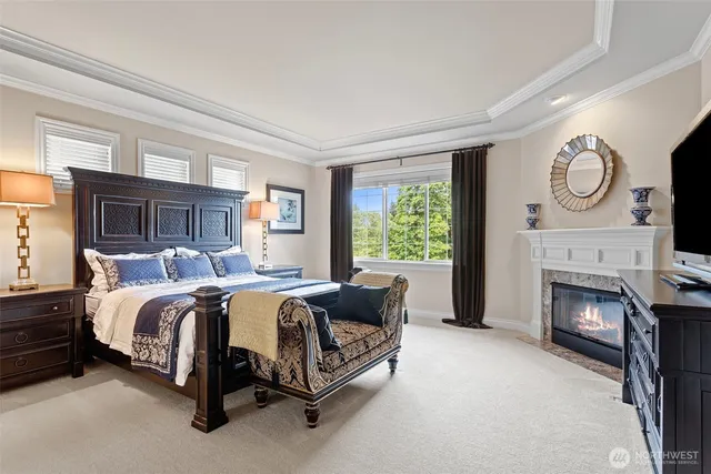 a bed room with a bed and a fireplace