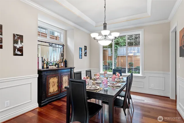 a view of a dining room with furniture window and wooden floor