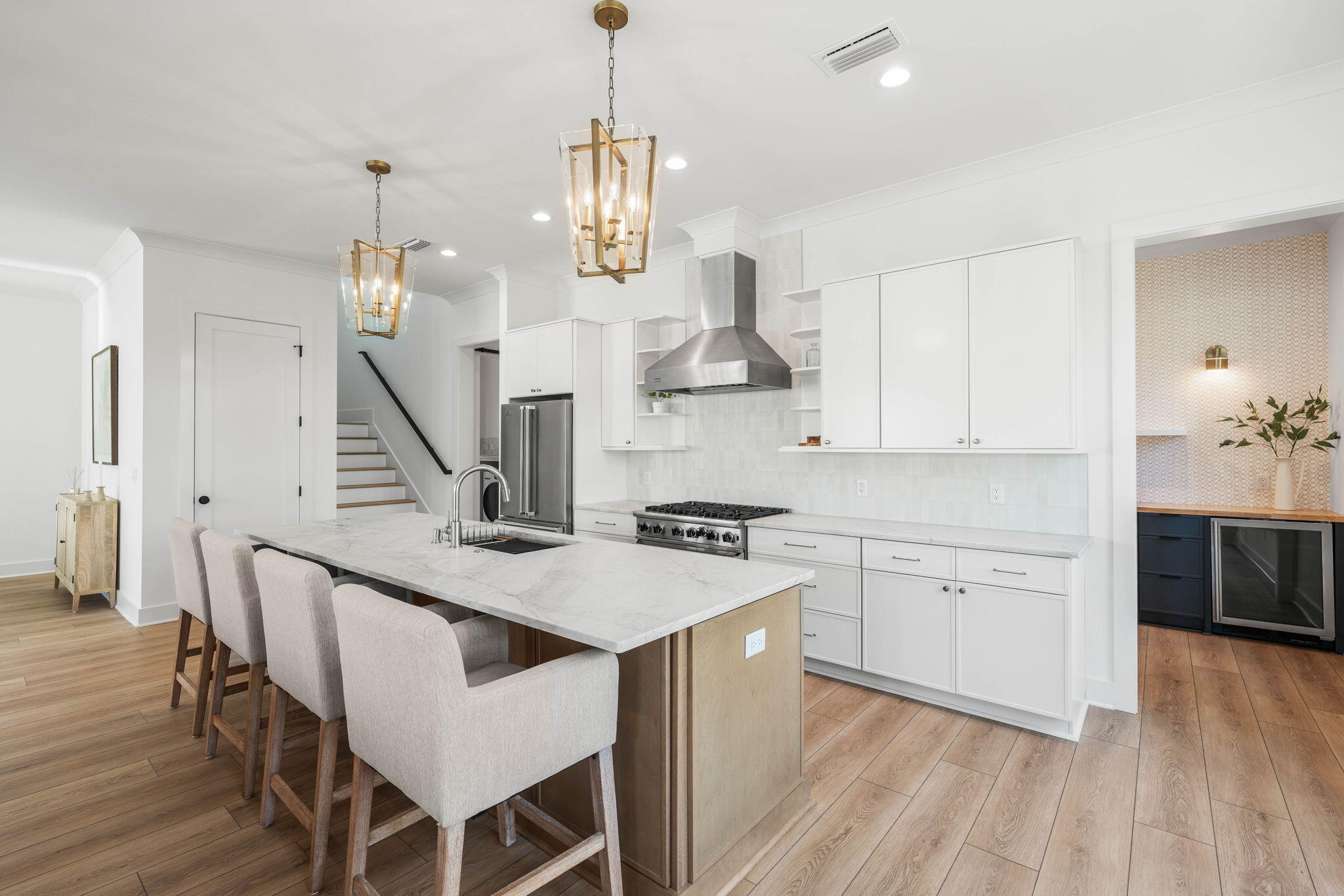 181 Plantation Circle Santa Rosa Beach, FL 32459 - Photo 12 of 69 a kitchen that has a lot of cabinets in it and wooden floors