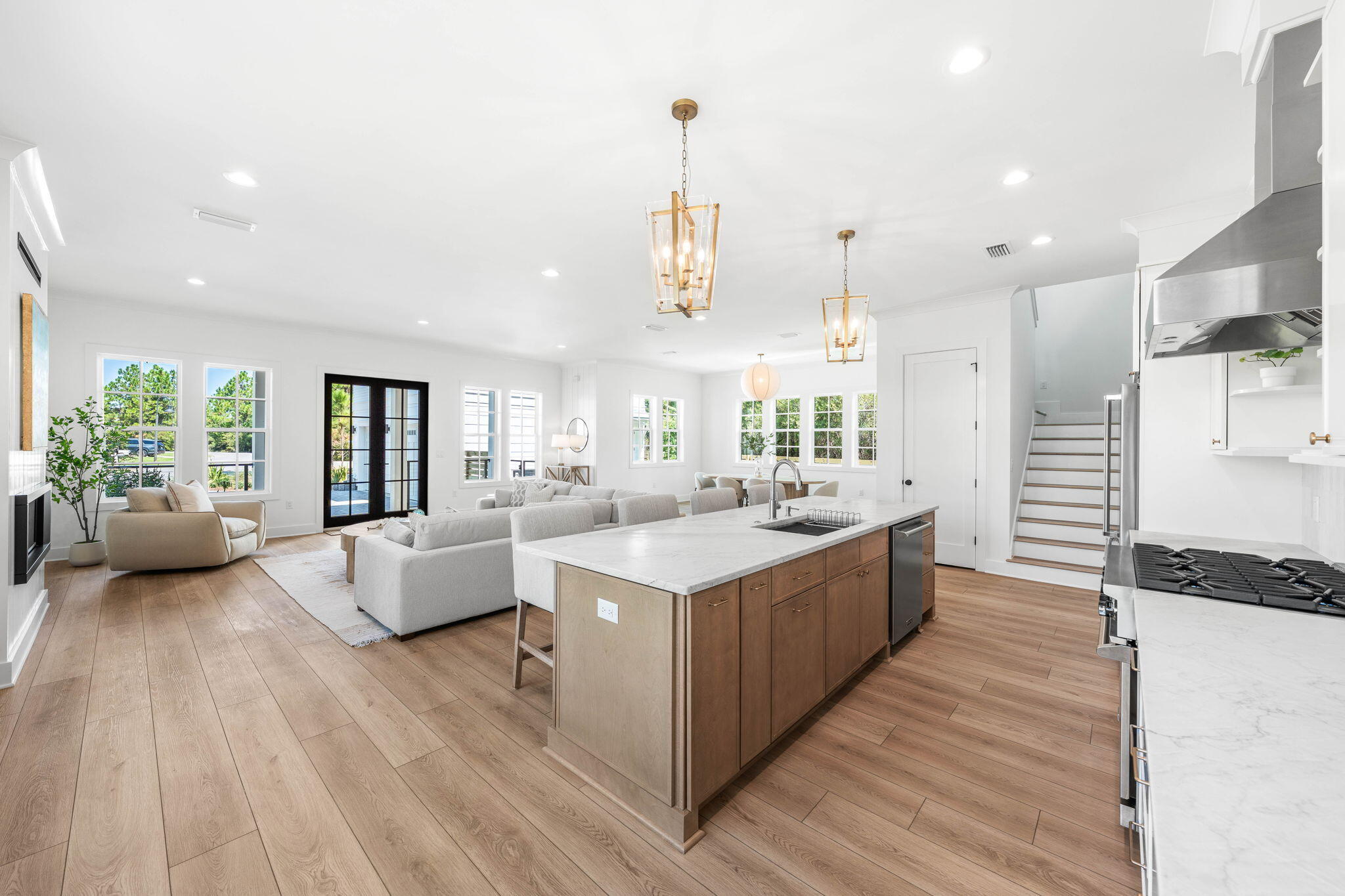 181 Plantation Circle Santa Rosa Beach, FL 32459 - Photo 13 of 69 a large white kitchen with a large window a sink and stainless steel appliances