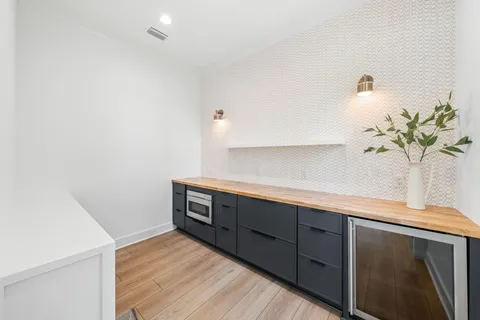 a view of an entryway with wooden floor and windows