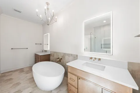 a view of a workspace with wooden floor and a bathroom