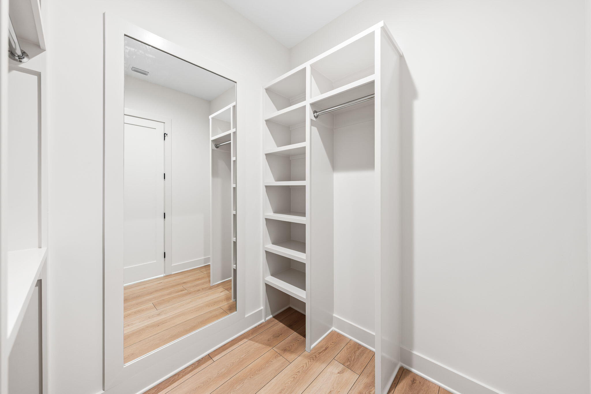 181 Plantation Circle Santa Rosa Beach, FL 32459 - Photo 24 of 69 a view of walk in closet with empty racks