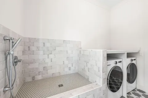 a bathroom with a shower and a sink