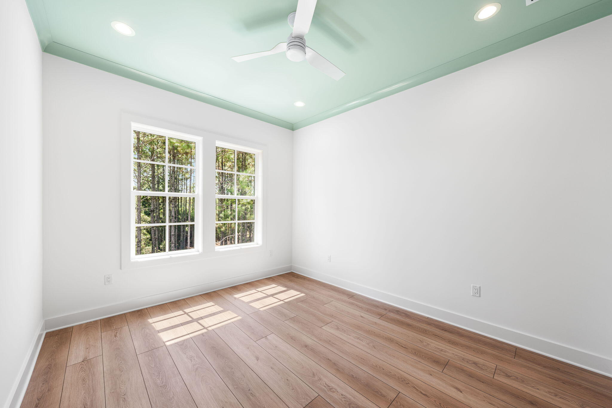 181 Plantation Circle Santa Rosa Beach, FL 32459 - Photo 31 of 69 an empty room with wooden floor and windows