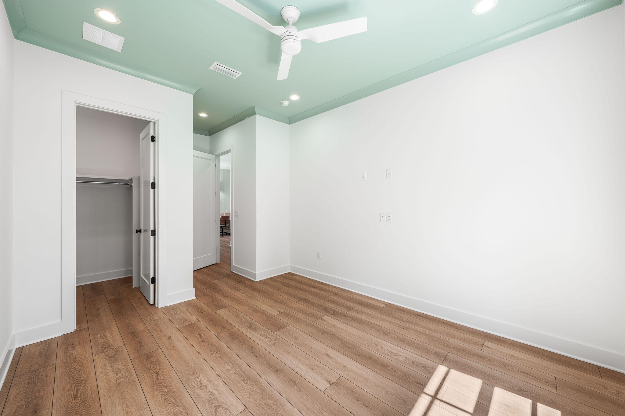 181 Plantation Circle Santa Rosa Beach, FL 32459 - Photo 32 of 69 a view of a big room with wooden floor and windows