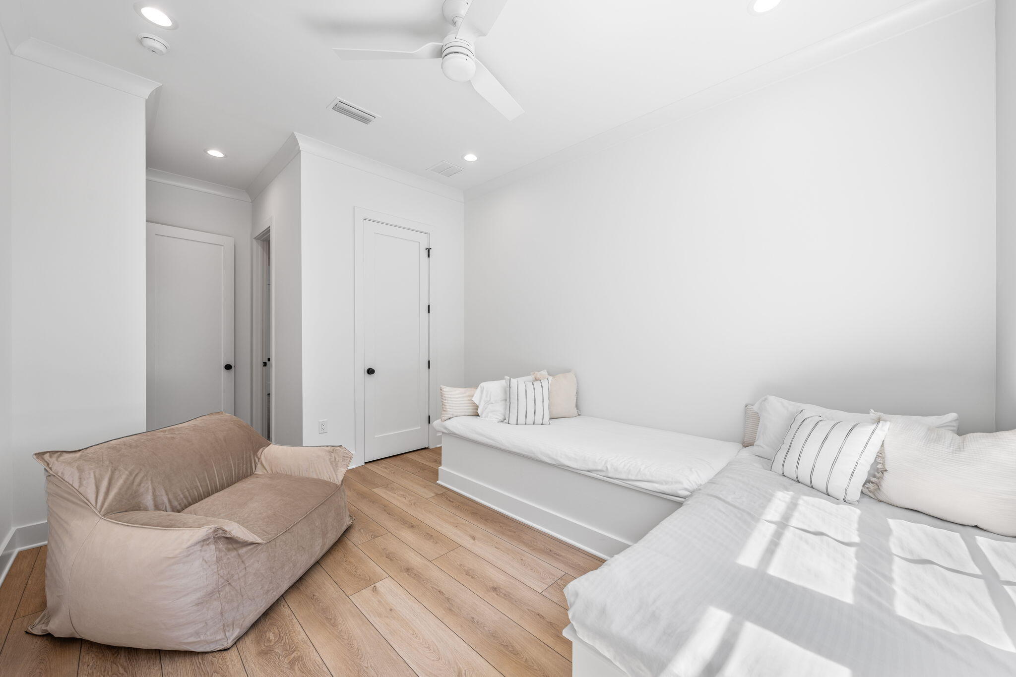 181 Plantation Circle Santa Rosa Beach, FL 32459 - Photo 35 of 69 a spacious bedroom with a bed and a couch