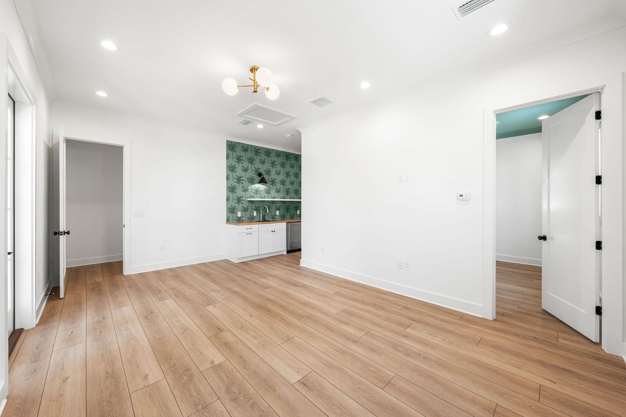 181 Plantation Circle Santa Rosa Beach, FL 32459 - Photo 49 of 69 an empty room with wooden floor and windows