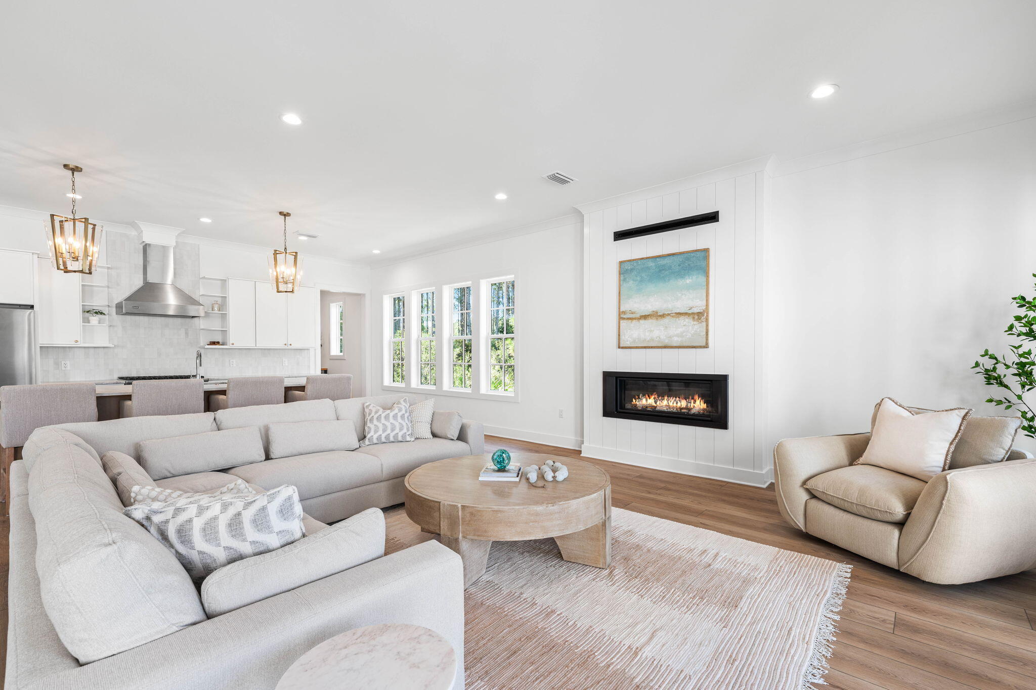 181 Plantation Circle Santa Rosa Beach, FL 32459 - Photo 5 of 69 a living room with furniture and a fireplace