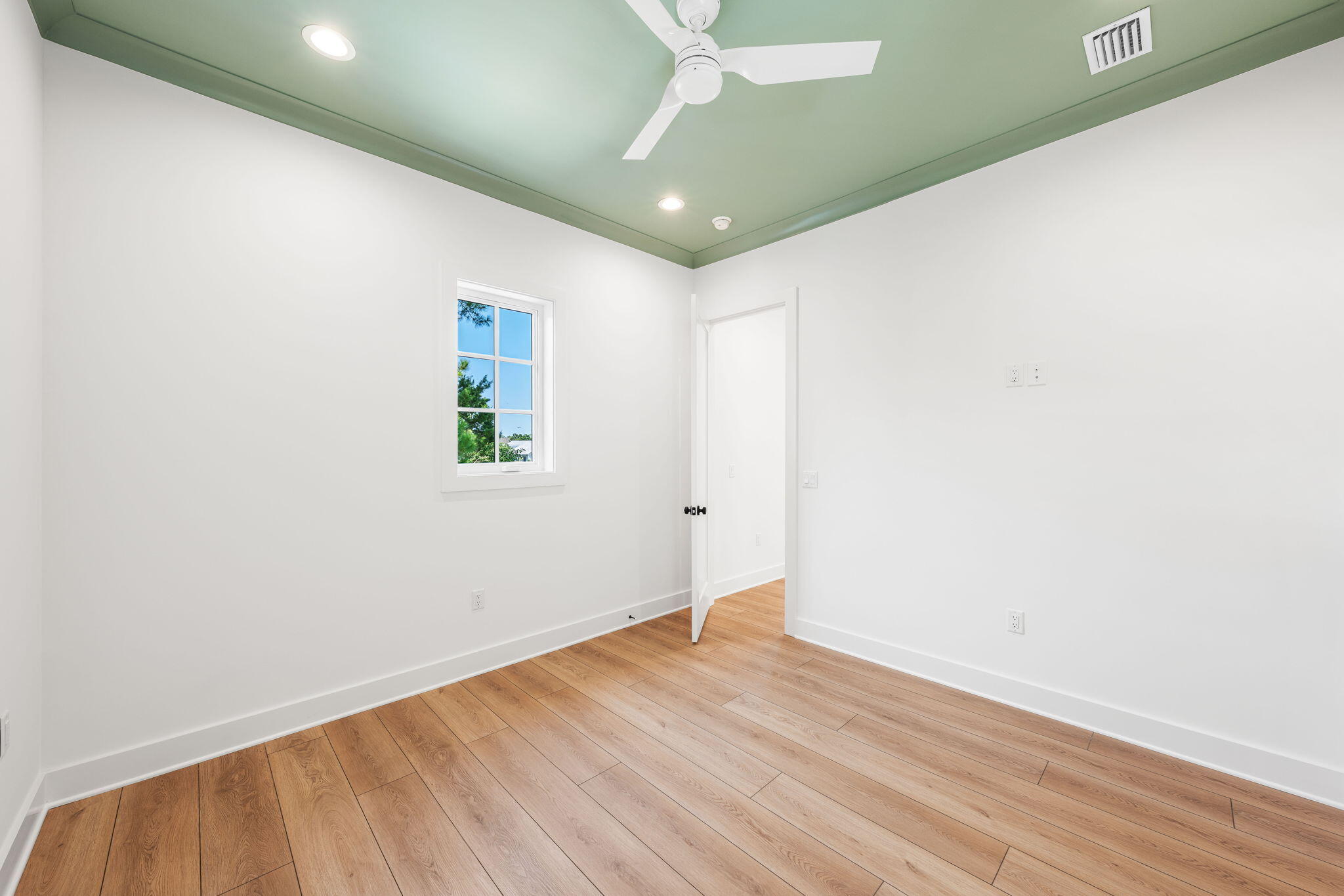 181 Plantation Circle Santa Rosa Beach, FL 32459 - Photo 55 of 69 an empty room with wooden floor and windows