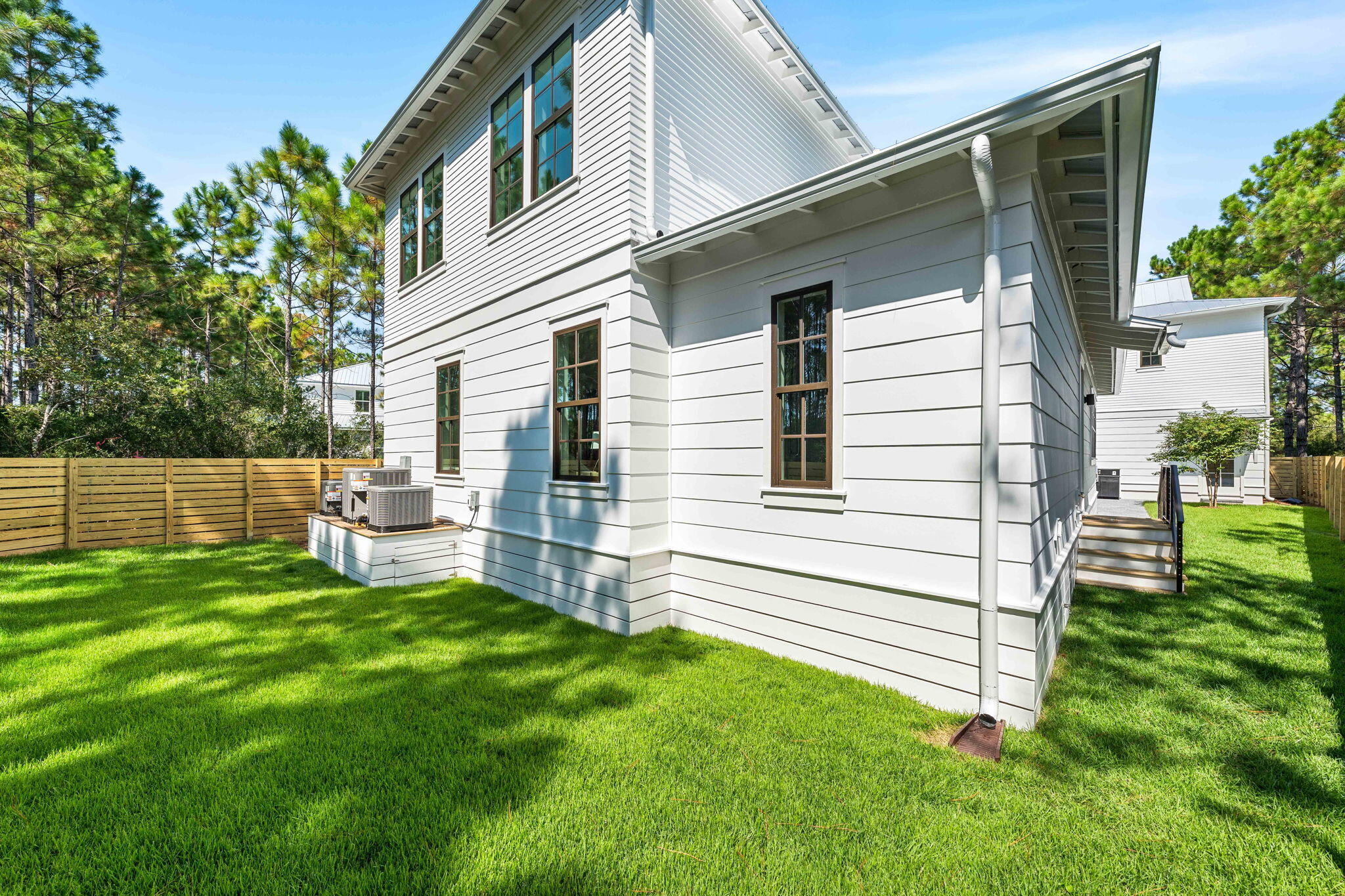 181 Plantation Circle Santa Rosa Beach, FL 32459 - Photo 58 of 69 a view of a house with a backyard
