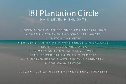 a large white kitchen with a large window a sink and stainless steel appliances