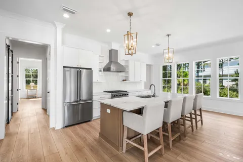 a view of a dining room with furniture and window