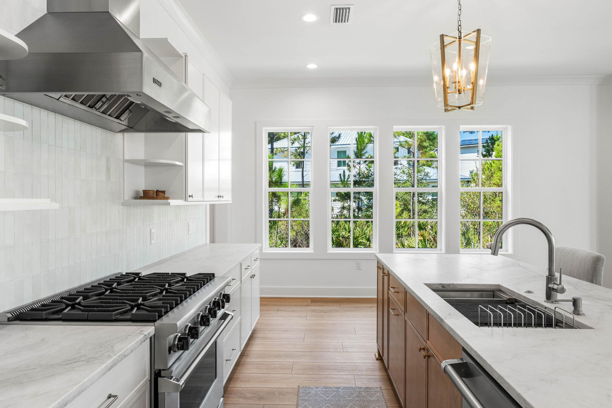 181 Plantation Circle Santa Rosa Beach, FL 32459 - Photo 10 of 69 a kitchen with granite countertop a stove and a sink
