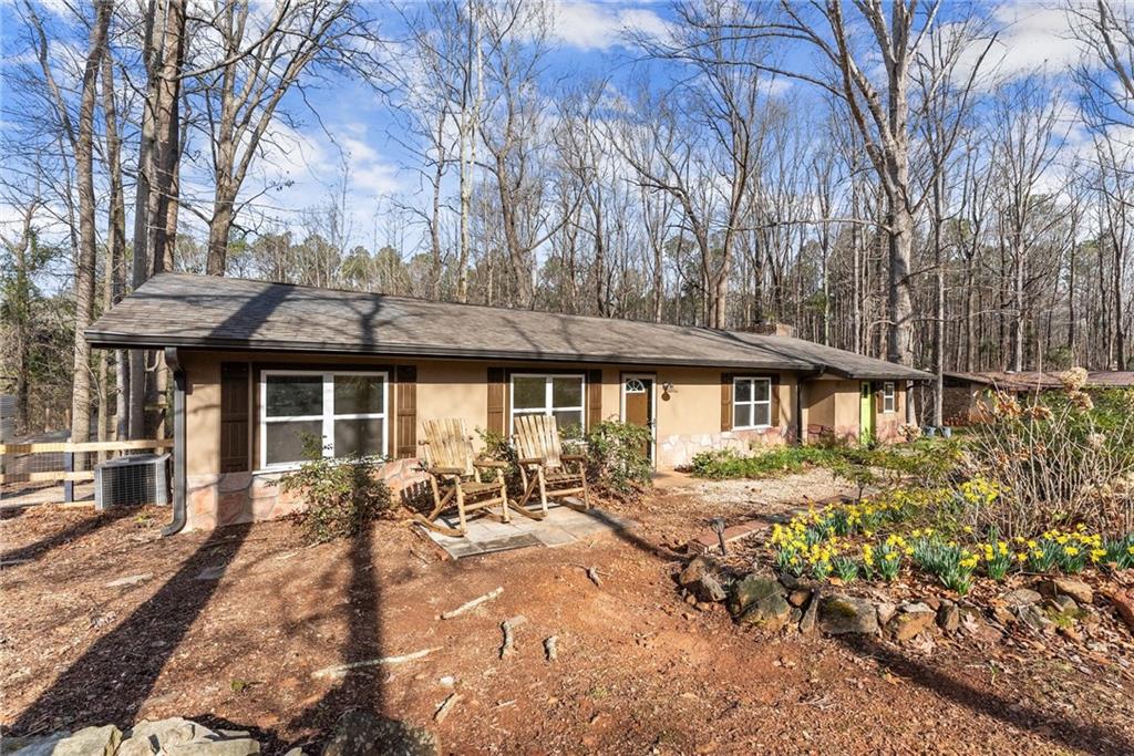 276 Chandler Bridge Road Nicholson, GA 30565 - Photo 1 of 1 a front view of a house with garden