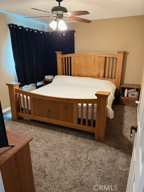 4552 West Ave L12 Lancaster, CA 93536 - Photo 13 of 39 a large bed sitting in a room next to a window