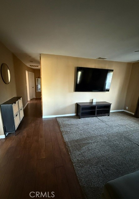 4552 West Ave L12 Lancaster, CA 93536 - Photo 19 of 39 a living room with furniture and a flat screen tv